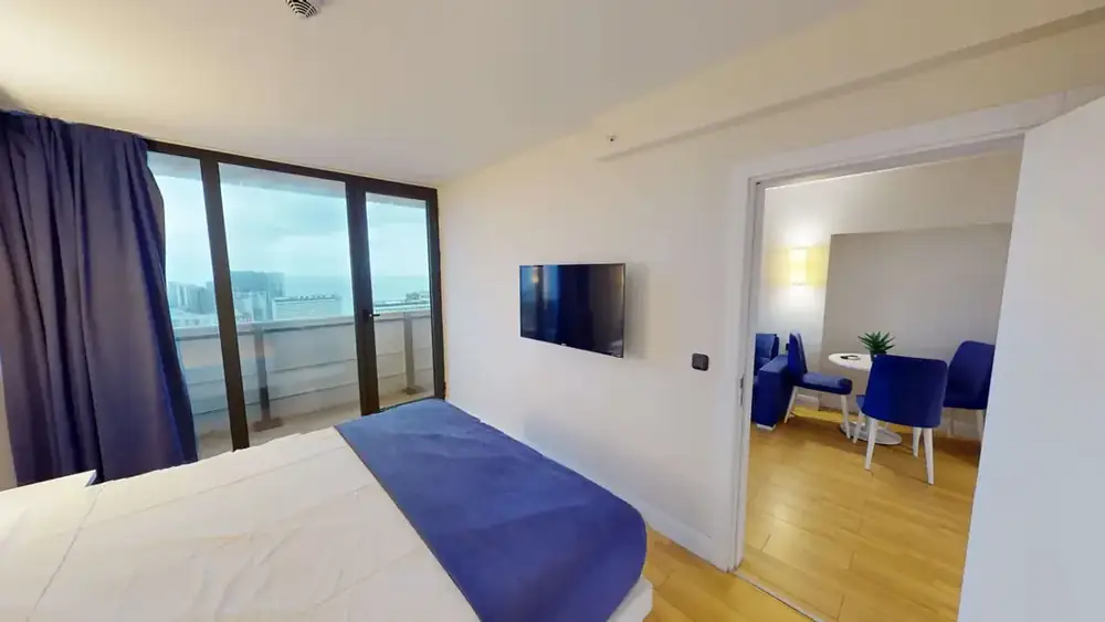 Bedroom and sea-view balcony in ORBI C 41/53
