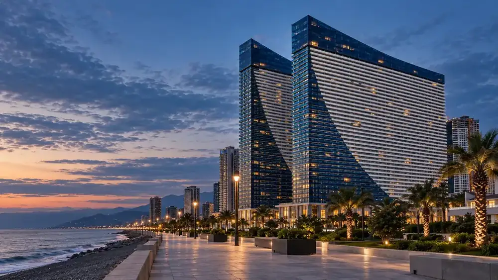 Architectural visualization of Orbi City’s exterior beside the promenade at dusk