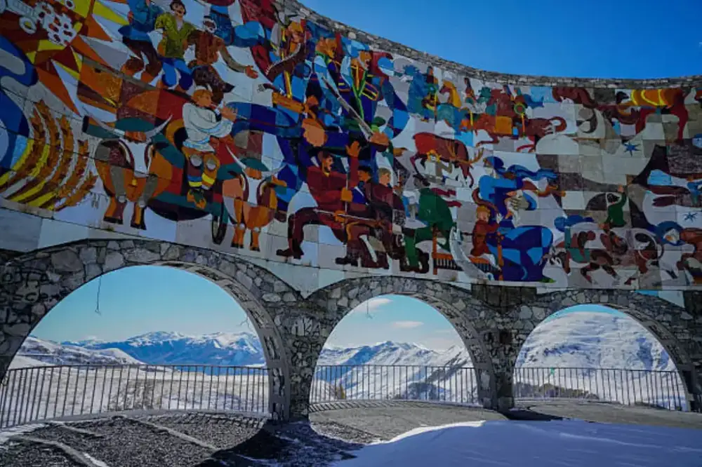 Gudauri Friendship Monument with Caucasus mountains, Georgia